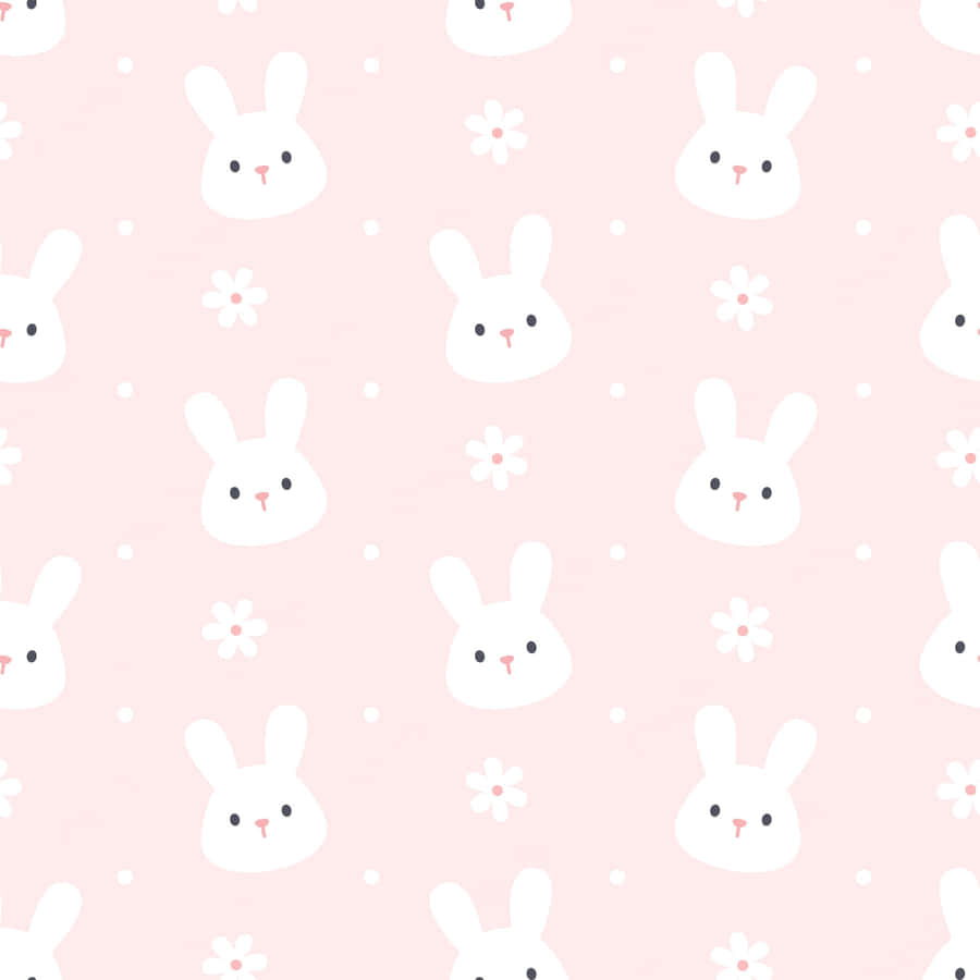 A Pink Background With White Bunny Faces And Flowers Wallpaper