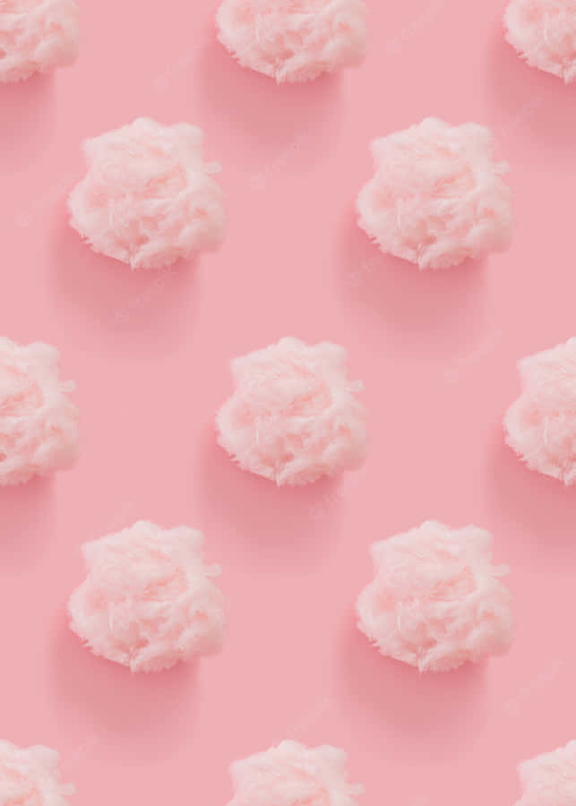 A Pink Background With White Clouds On It Wallpaper
