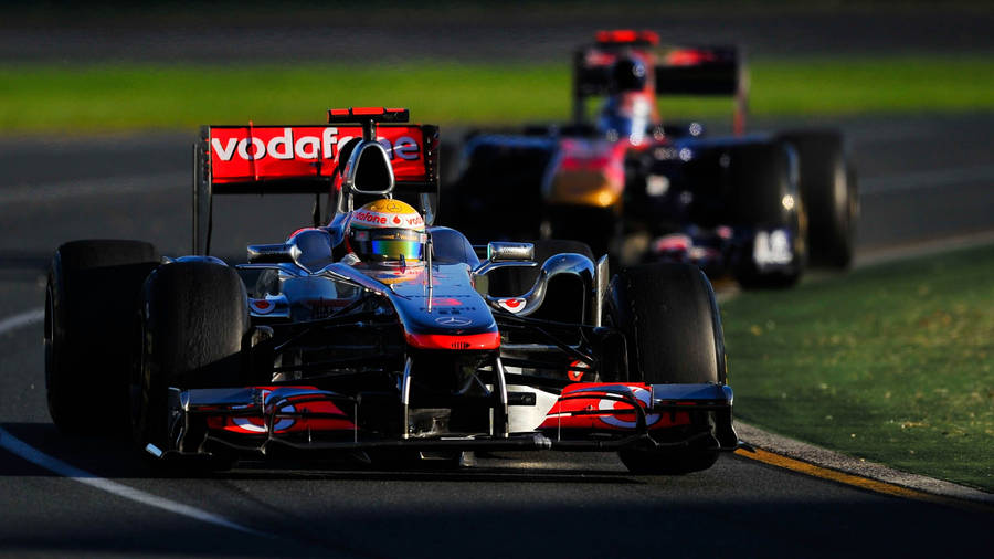 A Race Car Driving Wallpaper