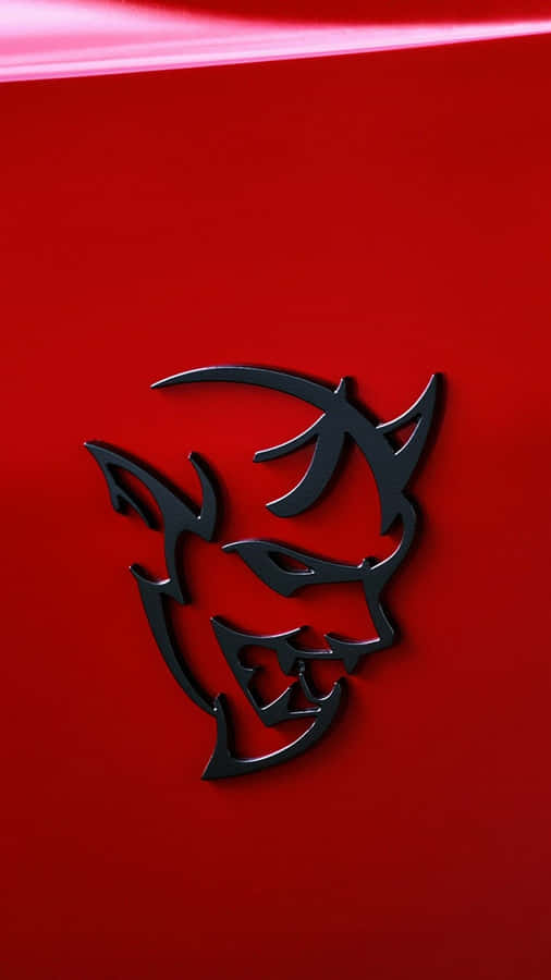 A Red Car With A Devil Hood Emblem Wallpaper