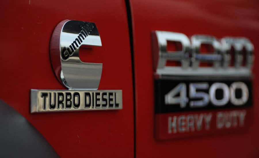 A Red Truck With A Logo That Says Turbo Diesel Wallpaper