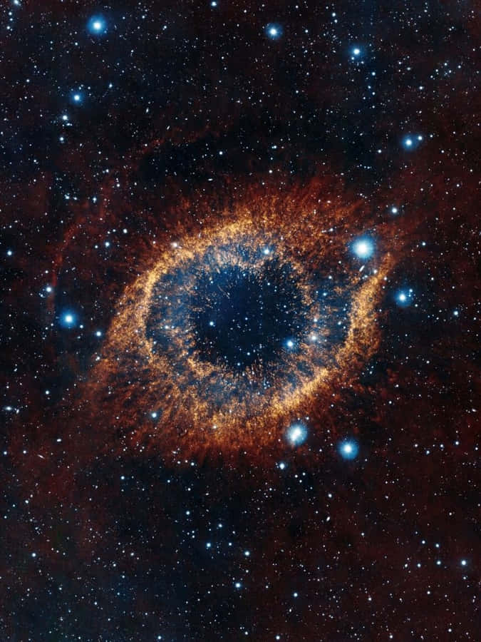 A Ring Shaped Nebula In Space Wallpaper