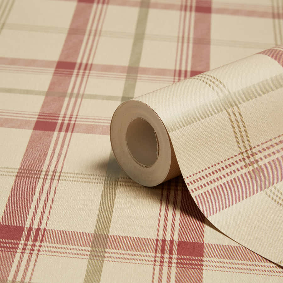A Roll Of Plaid Wallpaper On A Table Wallpaper