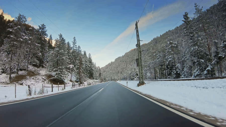 A Serene Snowy Landscape In The Winter Wallpaper