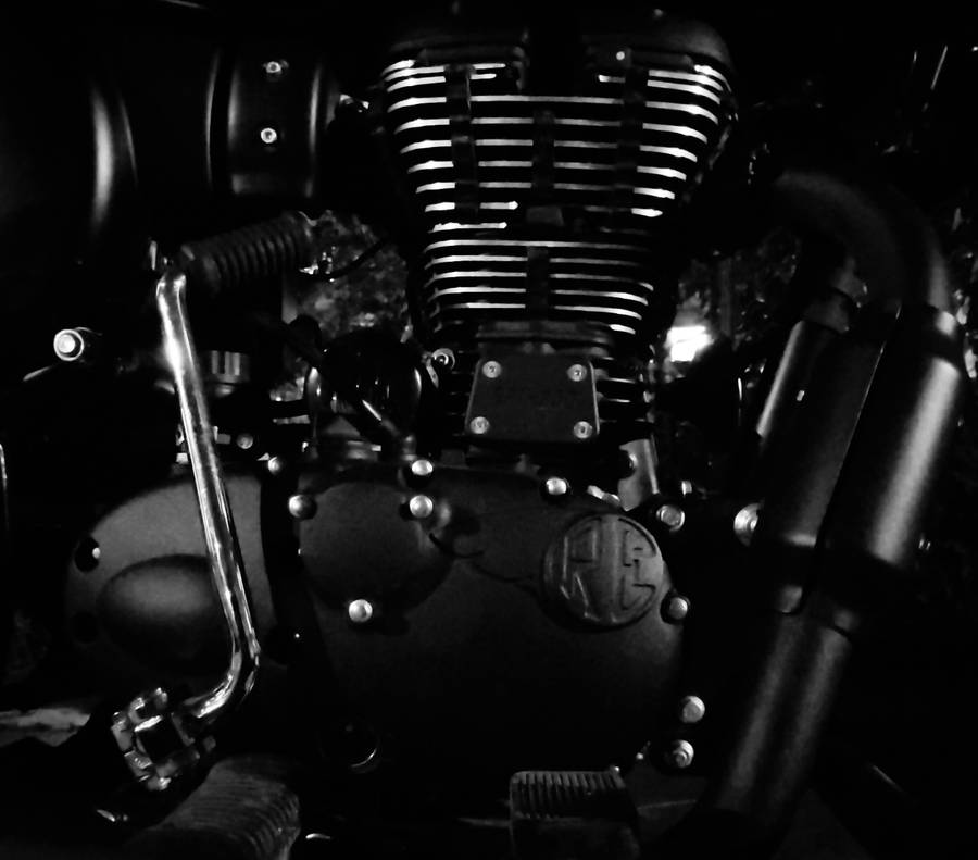 A Single Engine Motorcycle Oozing Strength And Power. Wallpaper