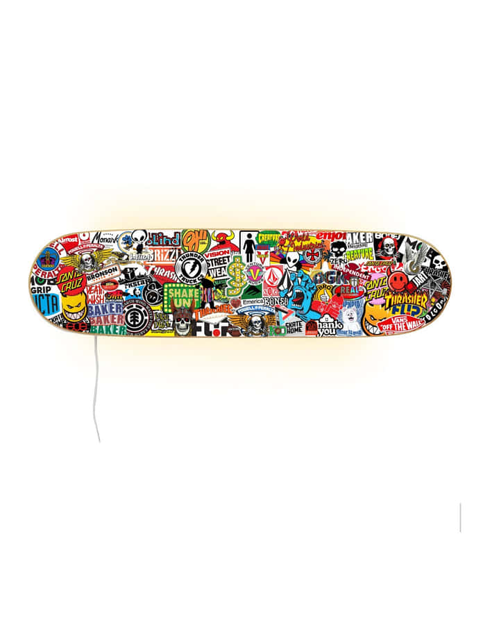A Skateboard With Many Different Stickers On It Wallpaper