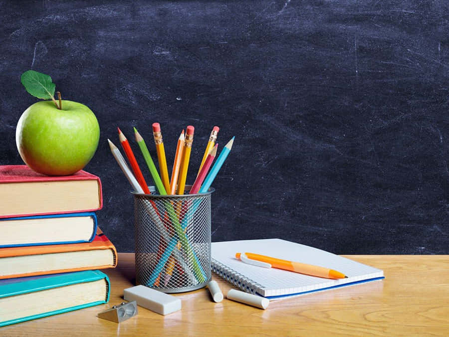A Stack Of Books And Pencils Wallpaper