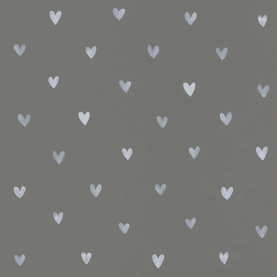 A Super Cute Grey Cat Cuddling With A Teddy Bear Wallpaper