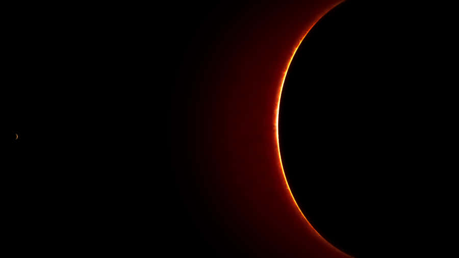 A View Of The Sun With A Red Ring Around It Wallpaper