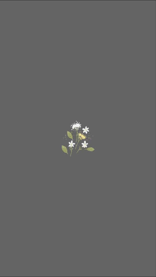 A White Flower With A Yellow Flower On A Gray Background Wallpaper