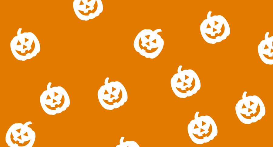 A White Pattern Of Pumpkins On An Orange Background Wallpaper