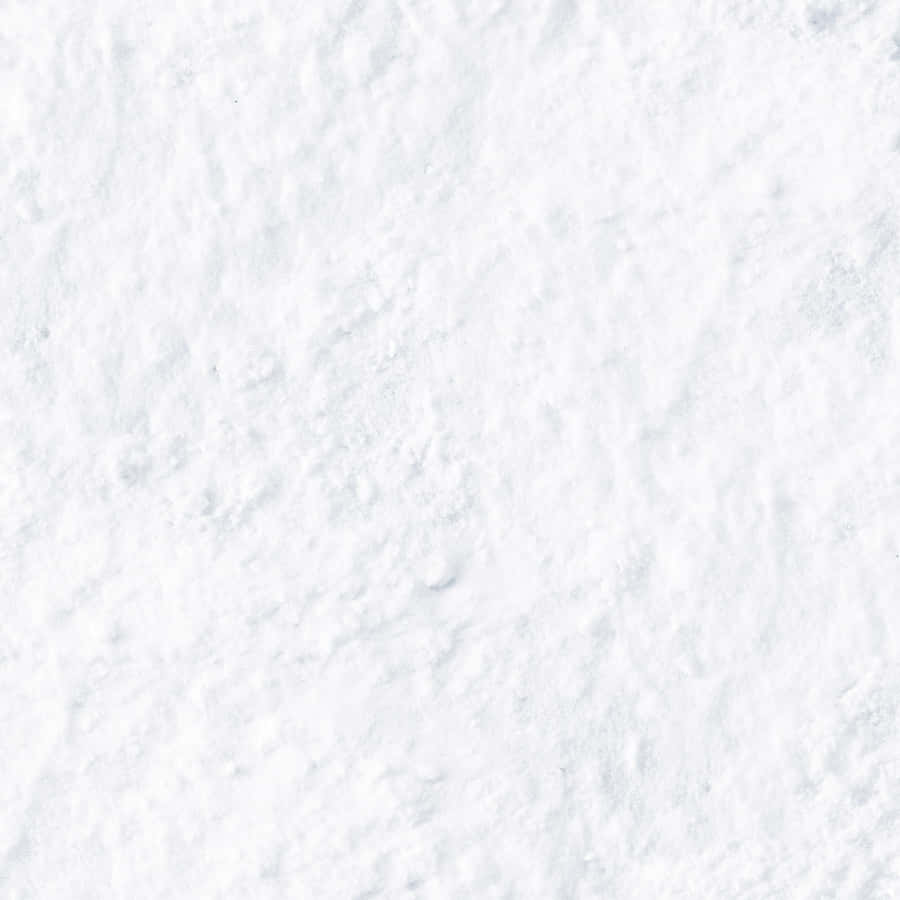 A White Snowy Background With A Snowflake Wallpaper