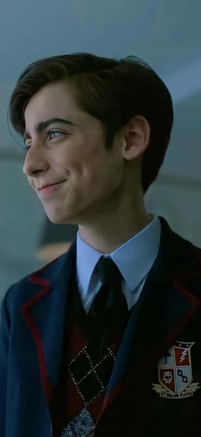 A Young Man In A School Uniform Is Smiling Wallpaper