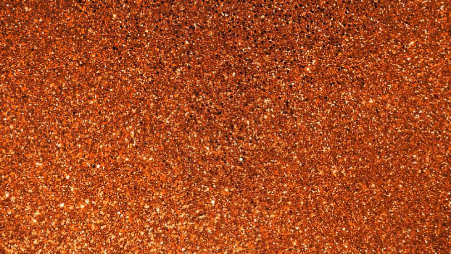 Add A Luxurious Sparkle To Your Space With Orange Glitter Wallpaper