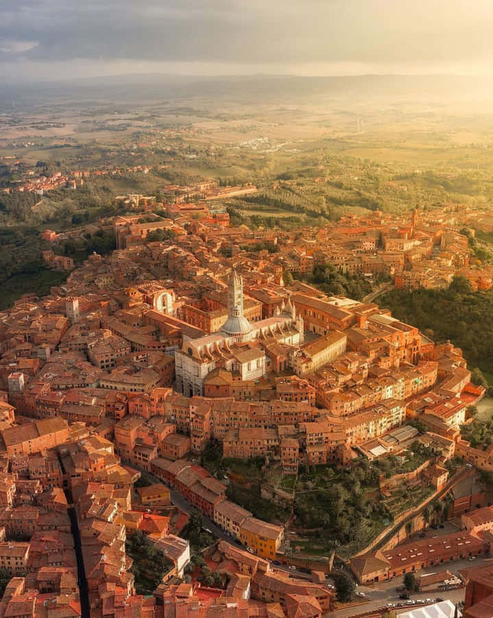 Aerial Shot Of Medieval Brick Buildings In Siena Wallpaper