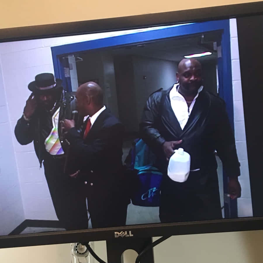 Ahmed Johnson Caught In A Candid Backstage Moment Wallpaper