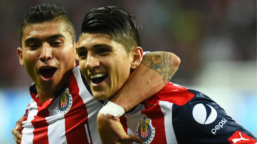 Alan Pulido And Orbelin Pineda Celebrating A Goal Wallpaper