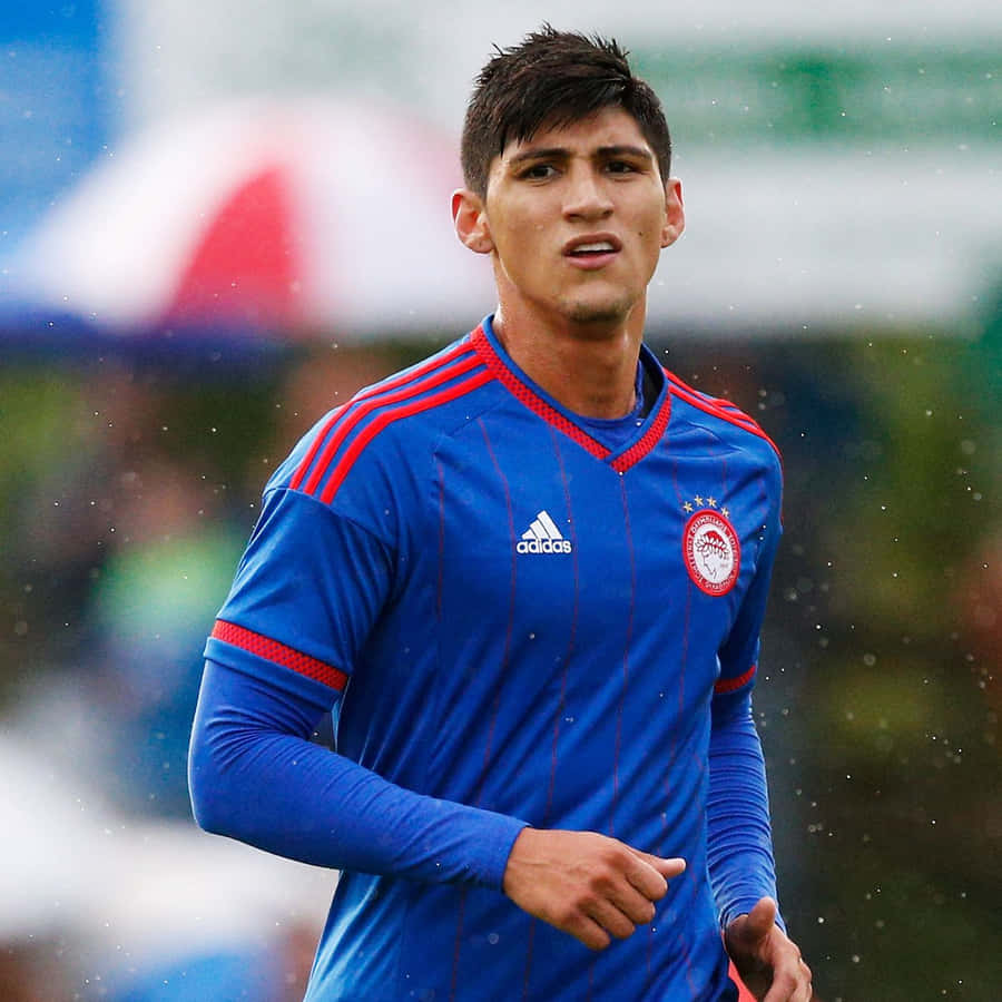 Alan Pulido In Blue Adidas Jersey Wallpaper