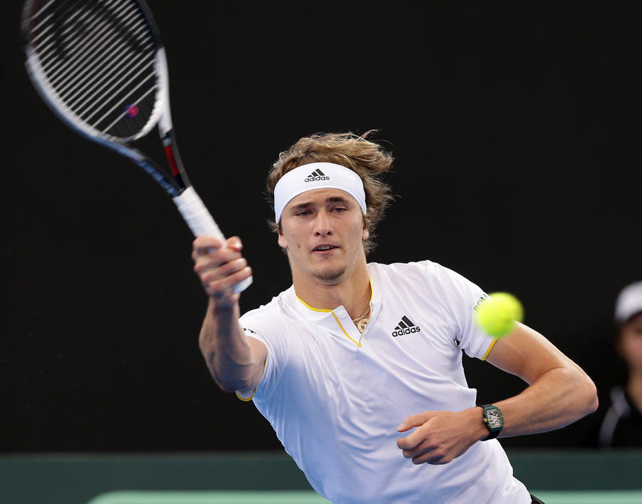 Alexander Zverev Delivers A Forehand Volley On Court Wallpaper