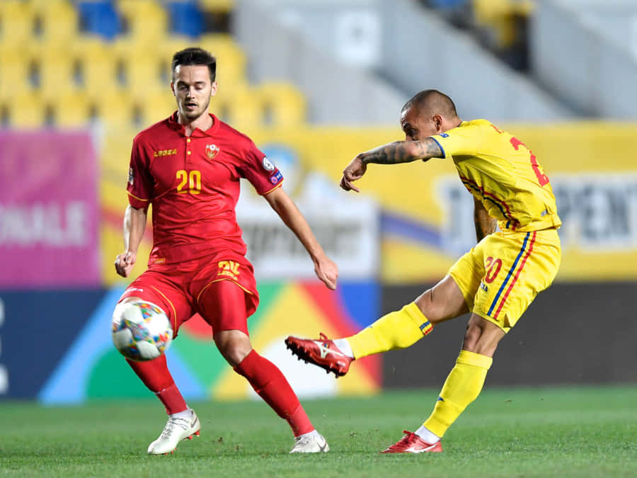 Alexandru Mitrita Kicking The Ball Past Mirko Ivanic Wallpaper