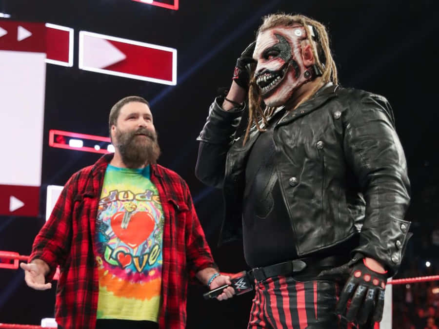American Former Wrestler Mick Foley And Fellow Wrestler Bray Wyatt Wallpaper