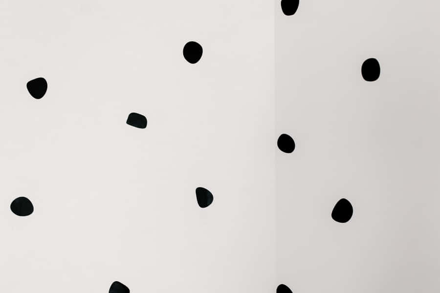 An Abstract Pattern Of Black And White Dots Wallpaper
