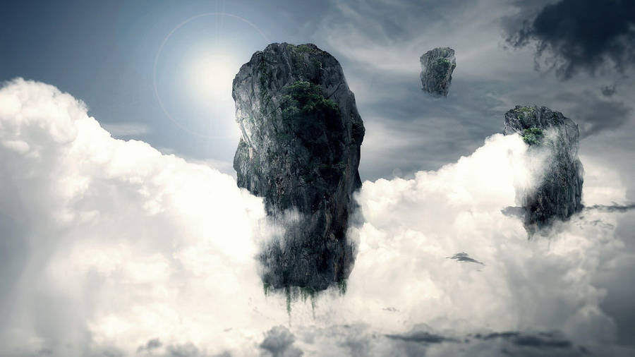 An Aerial View Of Majestic Rock Islands Surrounded By Fluffy Clouds Wallpaper