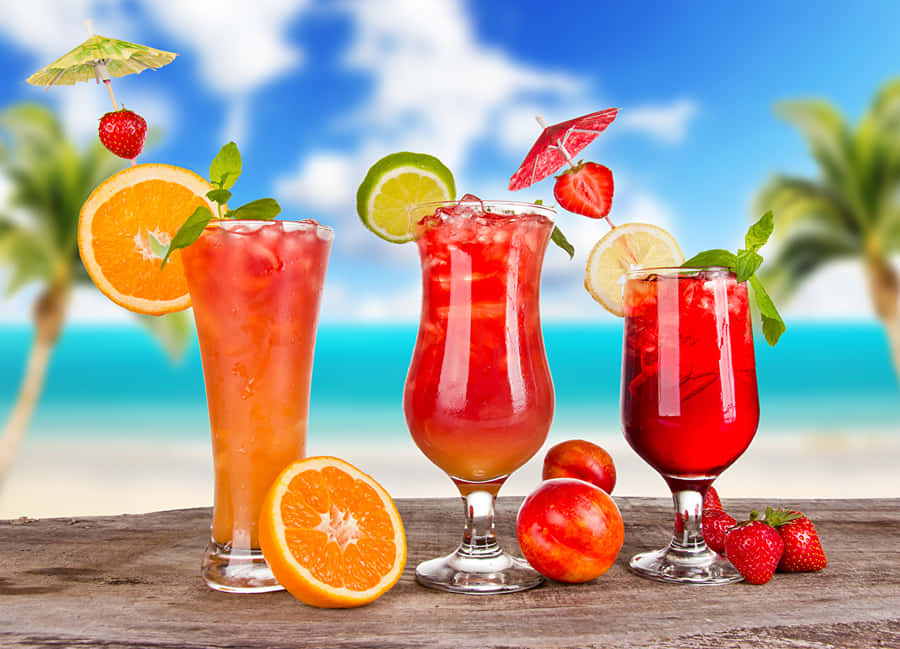 An Array Of Fresh Juices In Fancy Cocktail Glasses Wallpaper