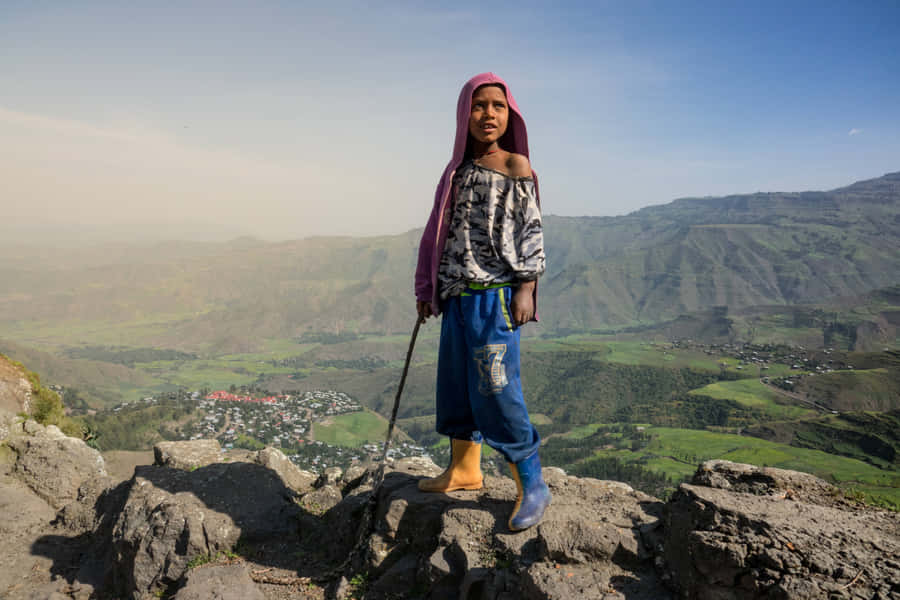 An Ethiopian Boy Above The Hills In Lalibela, Ethiopia Wallpaper