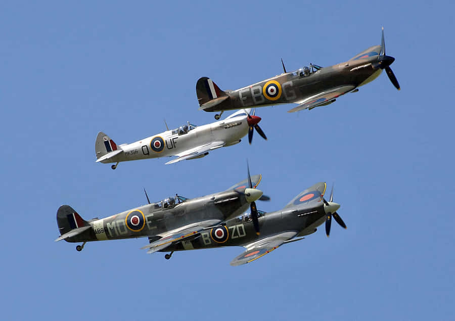An Iconic Spitfire Aircraft In Flight Over England Wallpaper