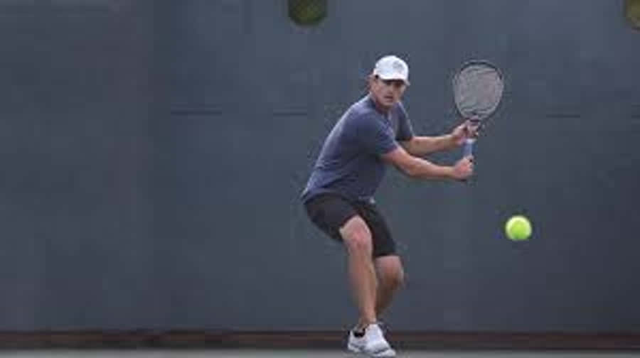 Andy Roddick Looking Down At Ball Wallpaper