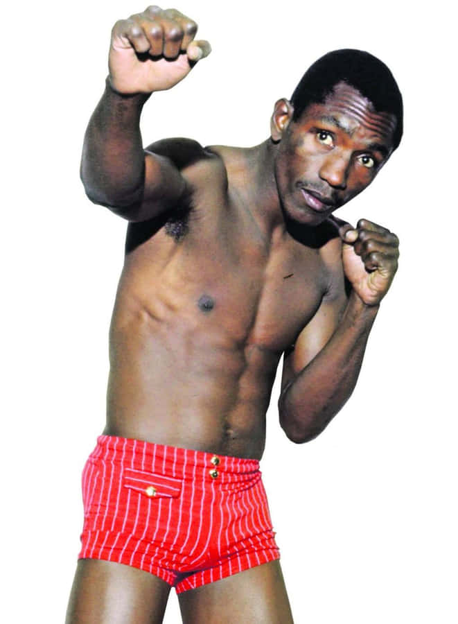 Antonio Cervantes Wearing Red Shorts On White Wallpaper