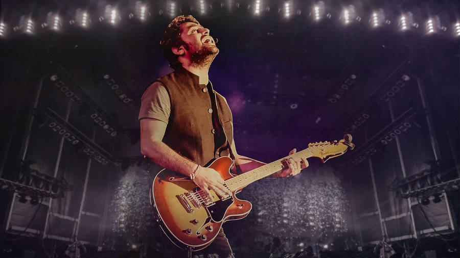 Arijit Singh Playing An Electric Guitar Wallpaper