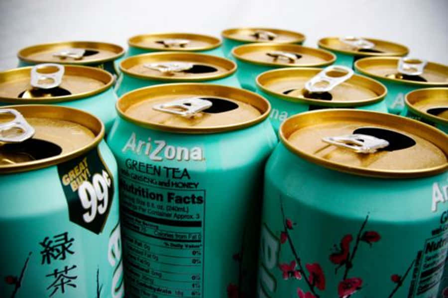 Arizona Tea Cans With Gold And Pink Flowers Wallpaper
