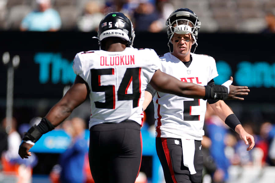 Atlanta Falcons Foyesade Oluokun And Matt Ryan Wallpaper