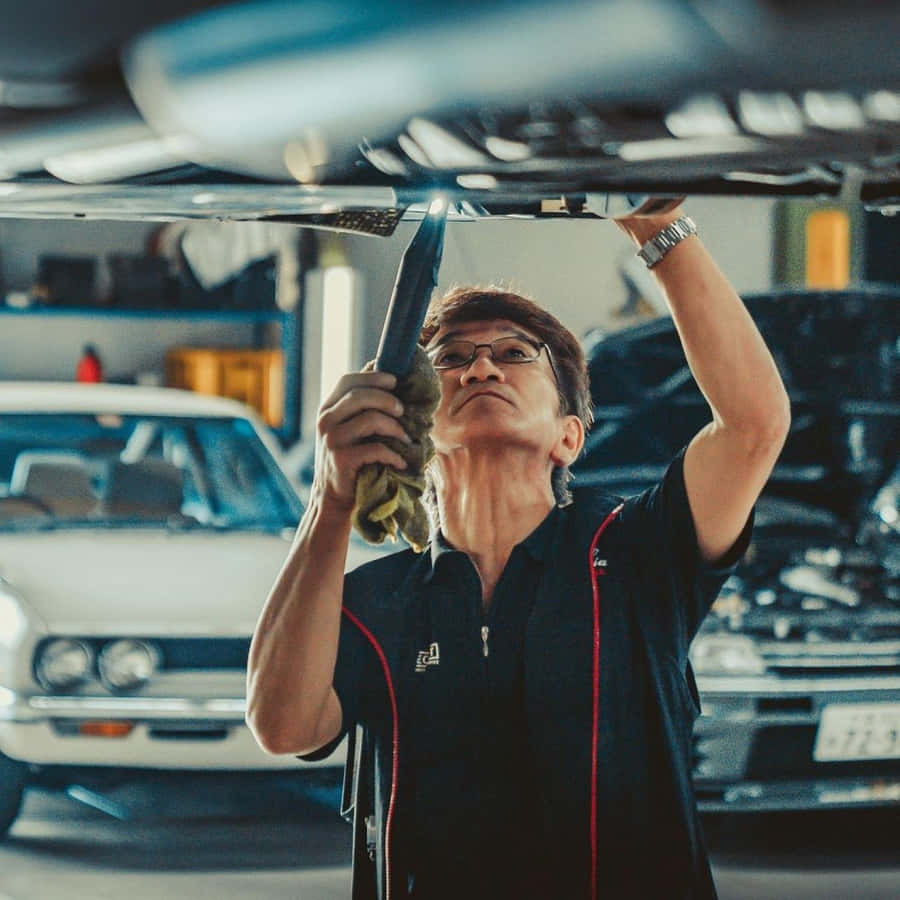 Auto Mechanic Inspection Undercarriage Wallpaper