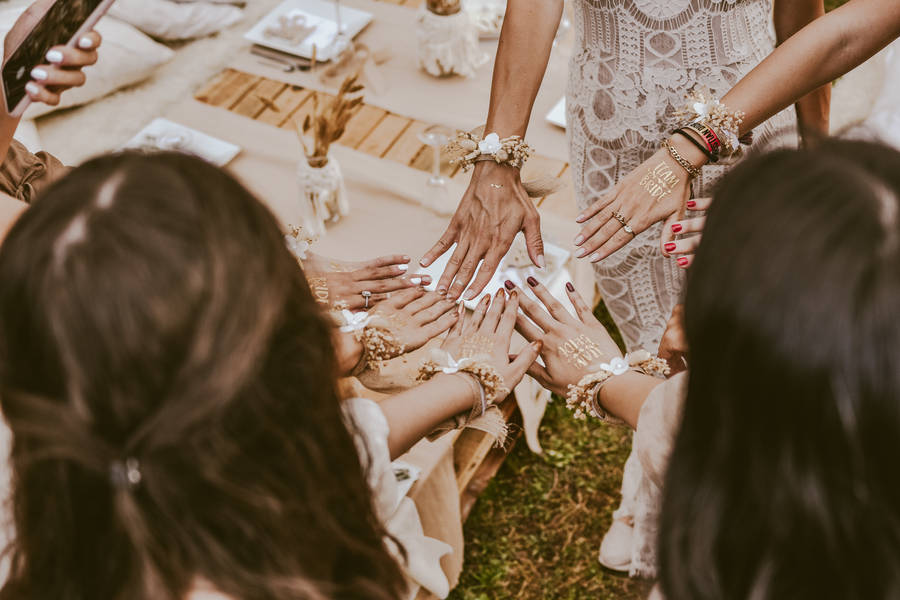 Bachelorette Party Attendees Showing Off Hands Wallpaper
