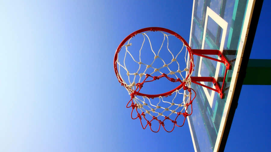 Basketball Hoop Against Blue Sky Wallpaper