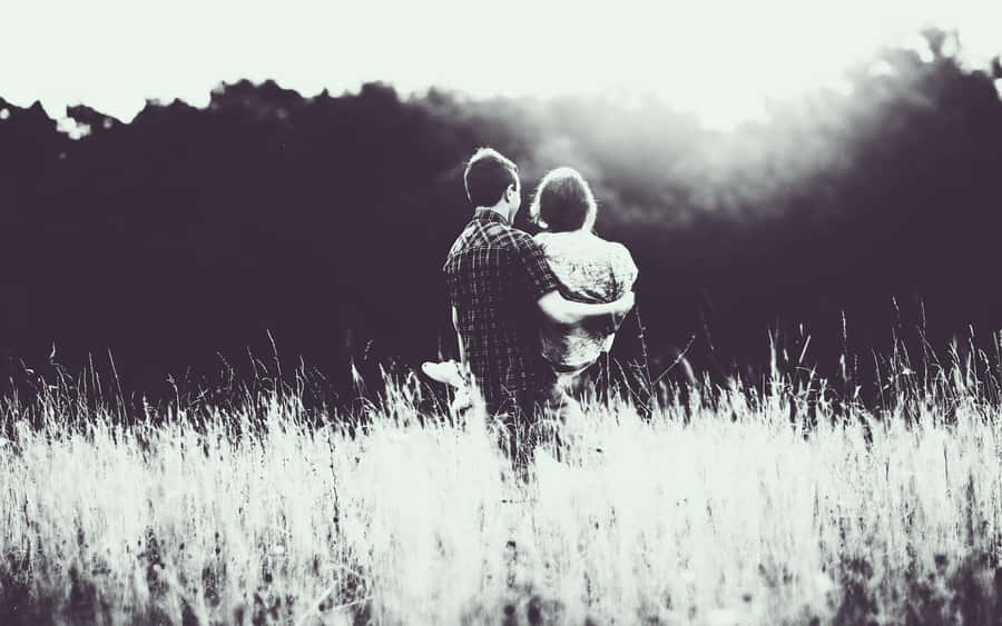 Beautiful Black Couple Embracing Each Other Wallpaper