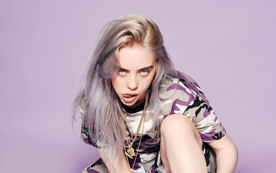 Billie Eilish In A Purple Background Wallpaper