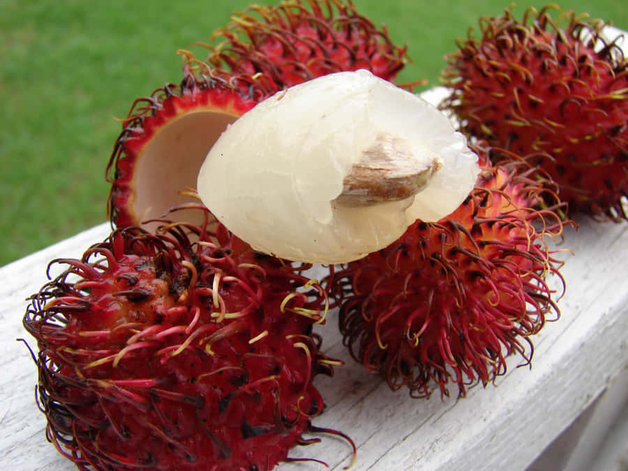 Bite Of Ripe Pulasan Fruits Wallpaper