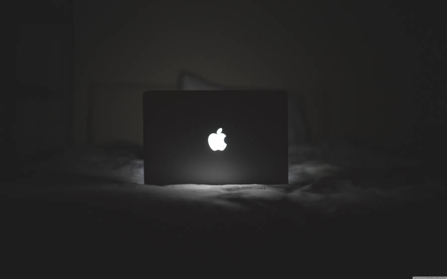 Black Macbook Laptop - Ready For Productivity And Creativity Wallpaper