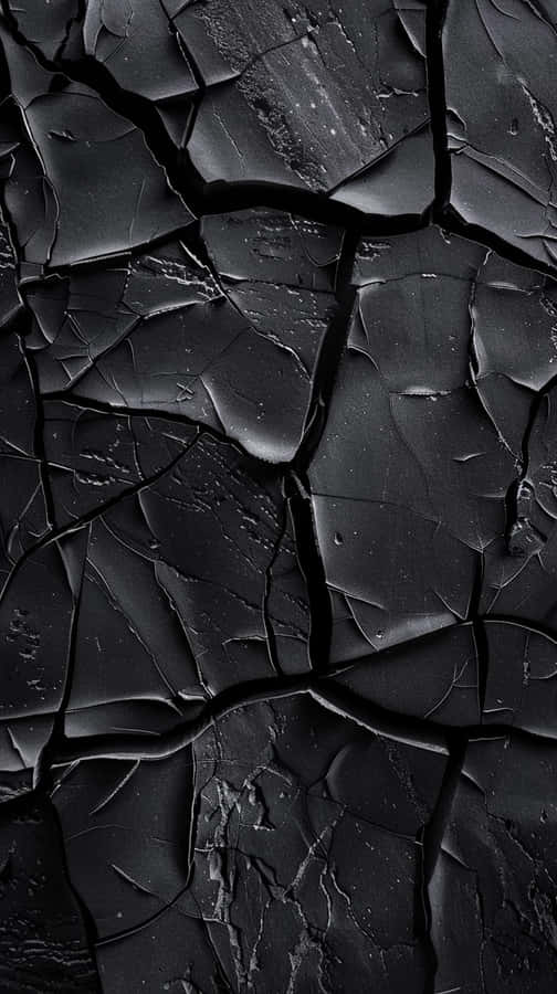Black Textured Surface Cracks Wallpaper