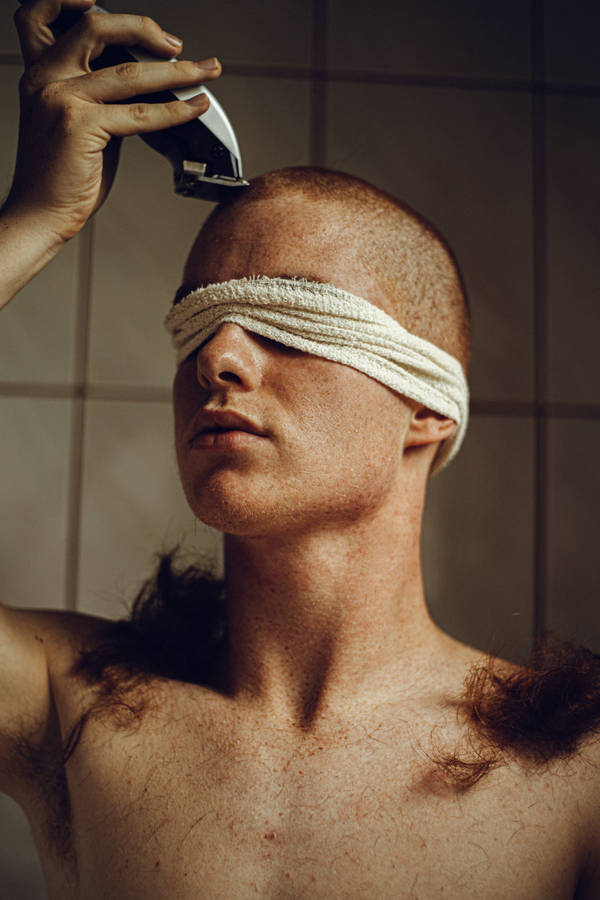 Blindfolded Man Gets Bald Haircut Wallpaper