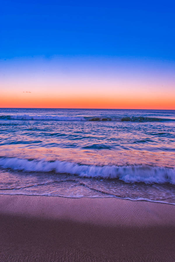 Blue And Orange Sunset Beach Android Wallpaper