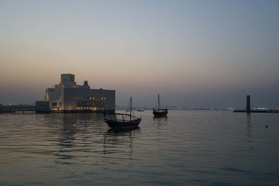 Boats At Dusk Near Museum Of Islamic Art Wallpaper