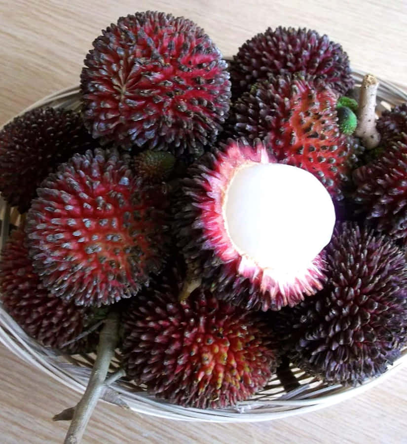 Bowl Of Ripe Pulasan Fruits Wallpaper