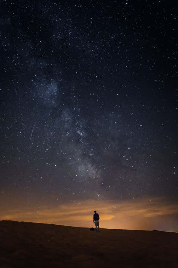 Boy Under Galaxy Sky Wallpaper