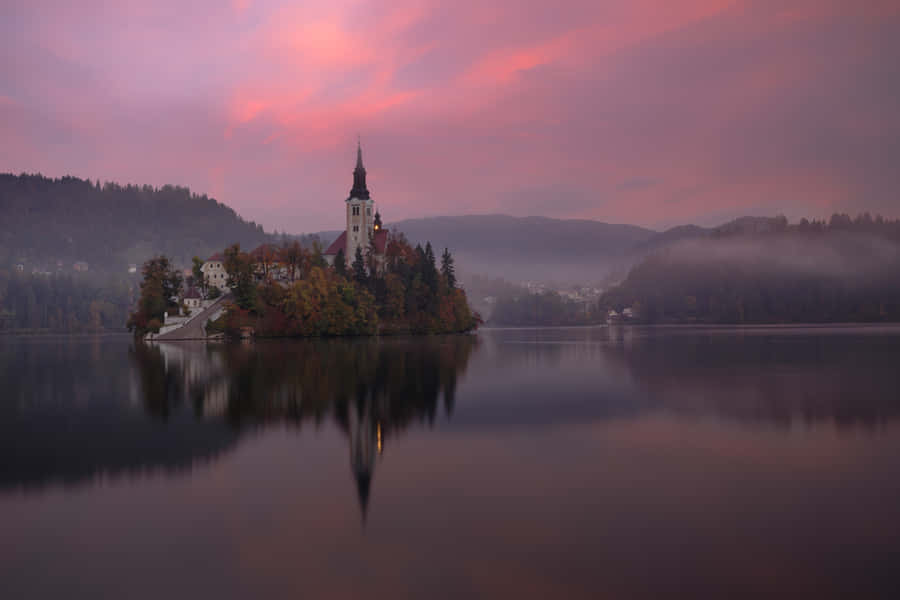 Breathtaking Twilight Scene In Lake Bled Wallpaper