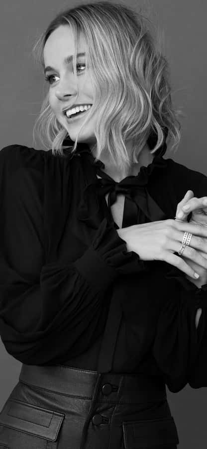 Brie Larson In A Vibrant Pose Wallpaper